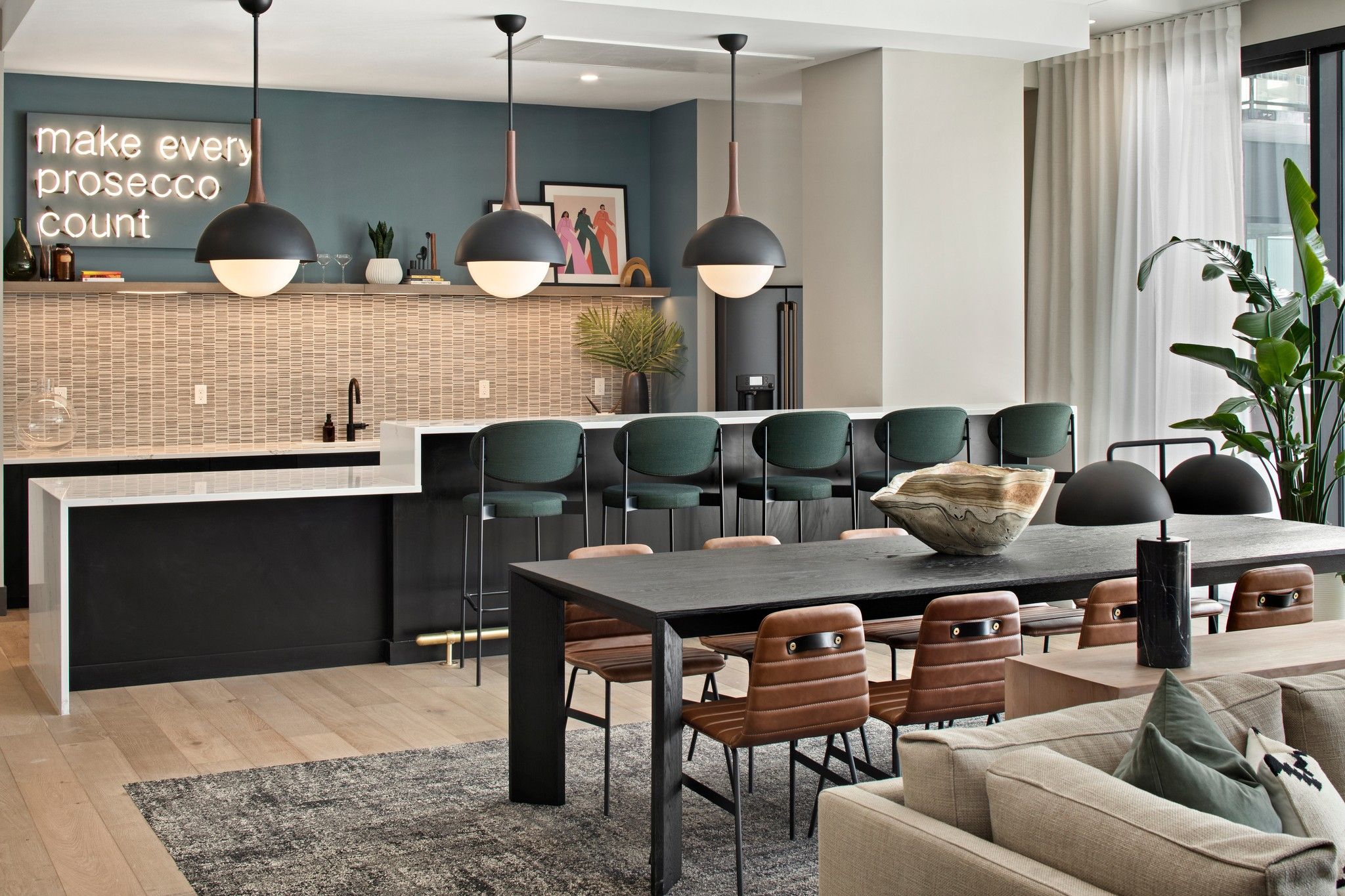 Fika Lounge apartment amenity with seating and kitchen area