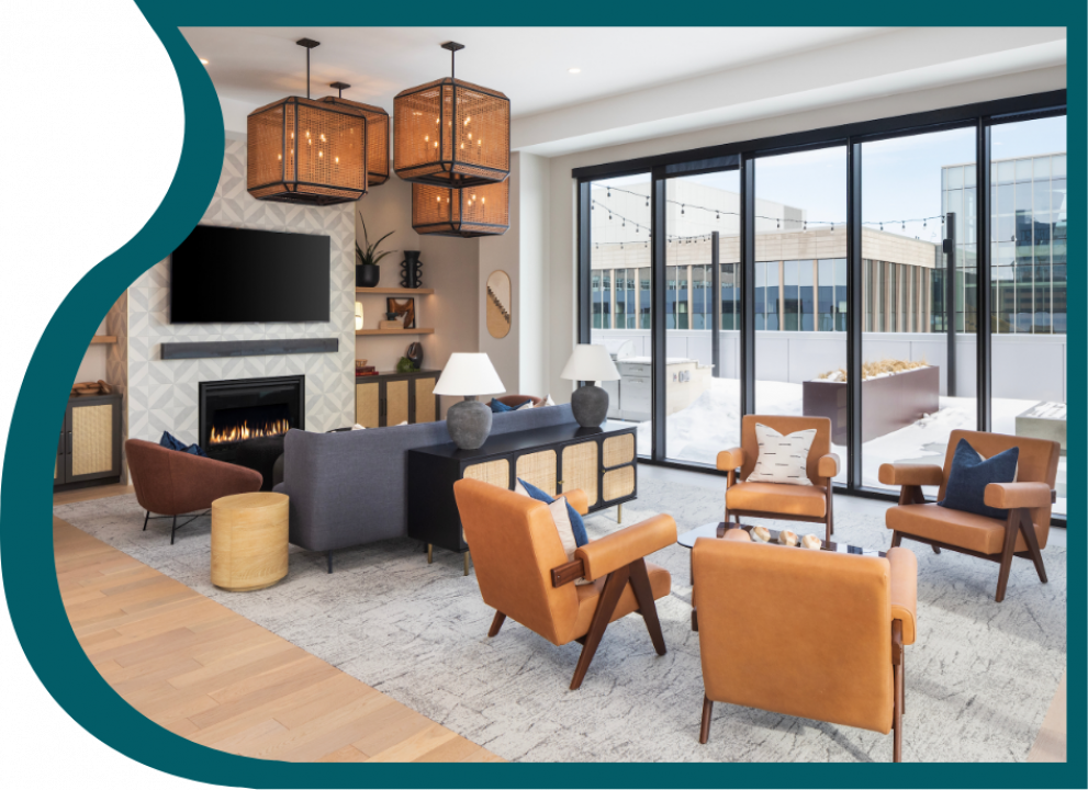 Resident amenity lounge with seating and skyline neighborhood views of Downtown Minneapolis