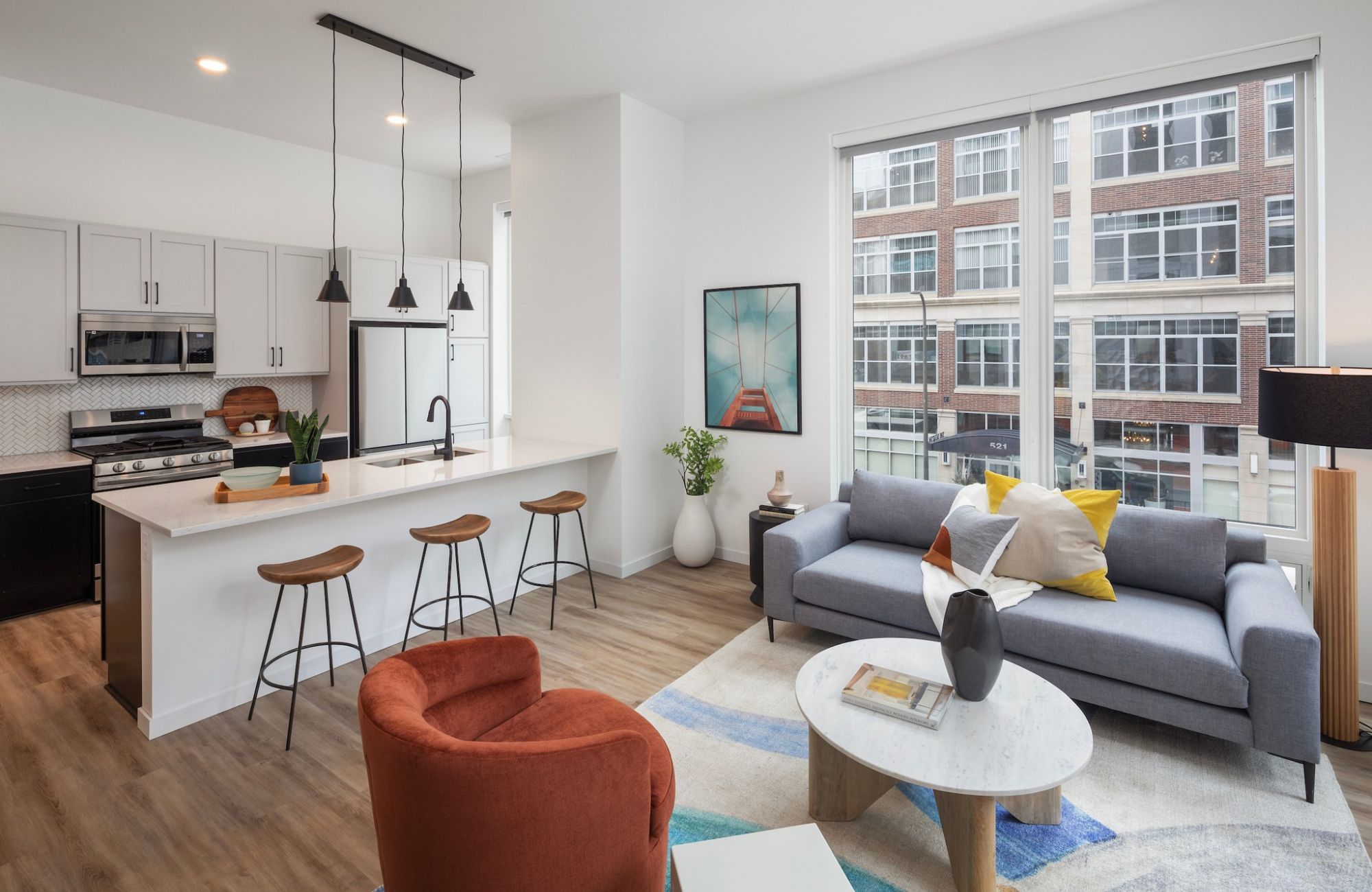 Moment Minneapolis apartments open floor plan layout with colorful furniture and lots of natural light